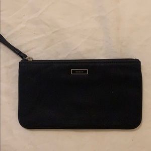 Coach canvas zipper pouch in black.